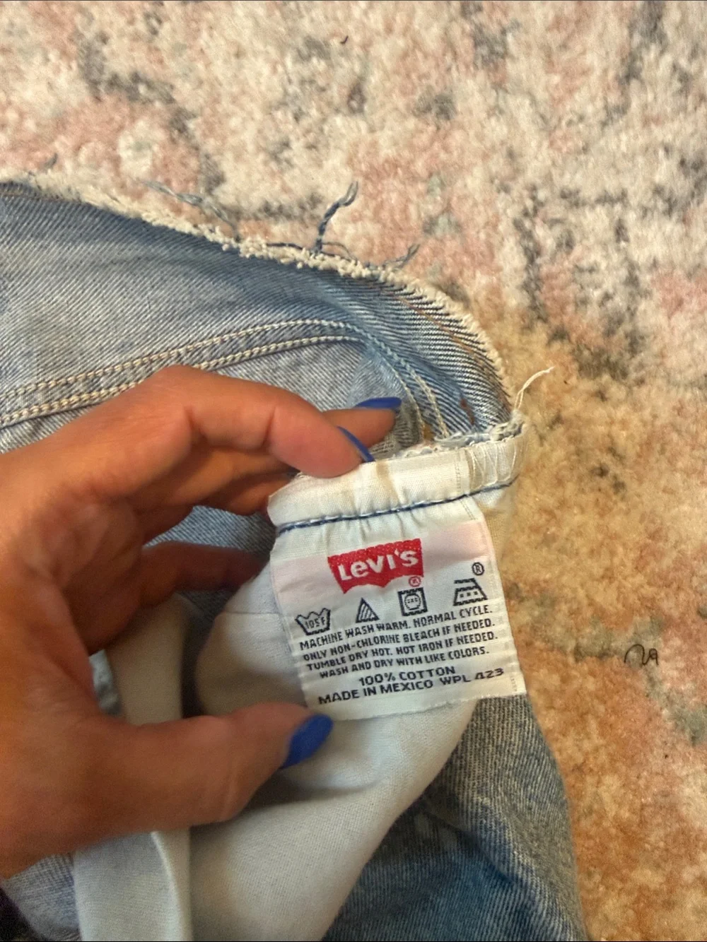 Levi's Distressed Blue Cropped Jeans with Paint Accents